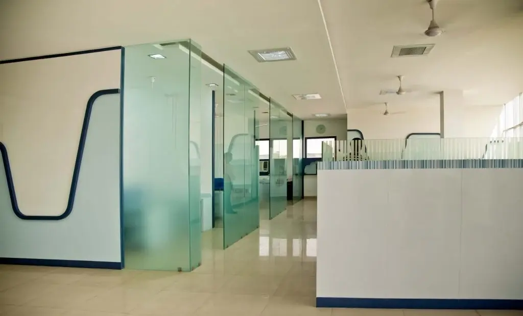 Modern office space in Norfolk with professionally tinted glass cubicles.